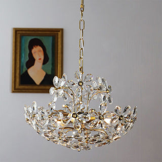 Modern crystal brass chandelier illuminated — bouquet luxury dining