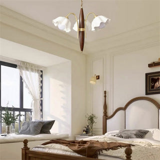 Vintage ceramic flower chandelier illuminated — walnut brass warm