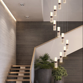 Luxury staircase crystal chandelier — long cascade warm ceiling