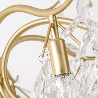 Large gold tiered chandelier ambient — crystal dining warm glow