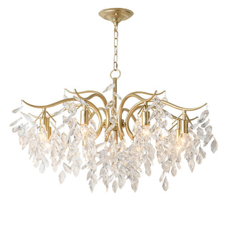 Large gold chandelier side — crystal tiered modern dining warm