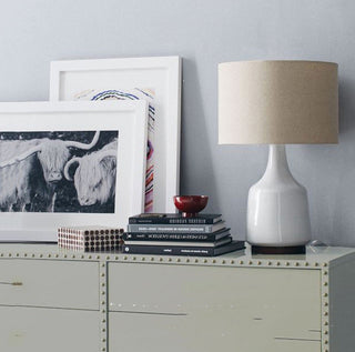 Handcrafted cove ceramic lamp — elegant ambient front view