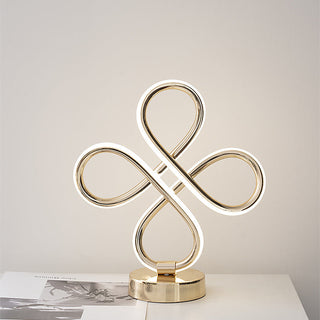 Modern golden table lamp — elegant gold loop design warm glow