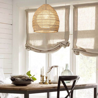 Handwoven basket pendant showing natural rattan weave