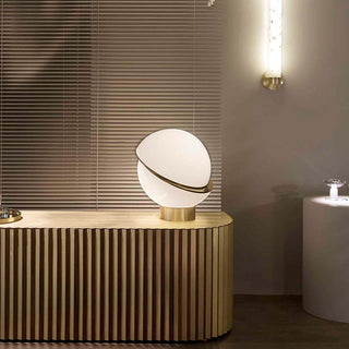 Elegant golden white lamp side view — warm ambient light