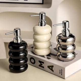 modern sleek pump design soap dispenser minimalist bathroom accessory angle view