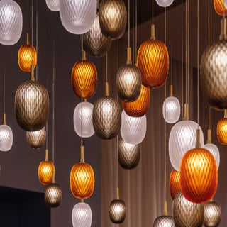 Stained glass ball pendant hanging in interior — iron frame lamp