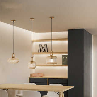 Clear glass pumpkin pendant with modern iron fixture