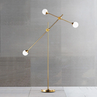 Modern glass orb floor lamp illuminated — swing arm warm