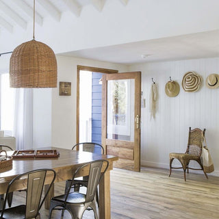 Short rattan basket pendant light side view — kitchen island lamp