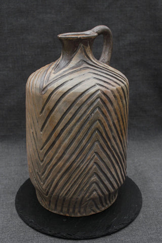 handmade pottery pitcher rustic ceramic jug smoke fired ceramics design close-up