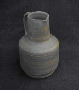 vintage pottery pitcher handcrafted clay ceramics rustic modern decor close-up