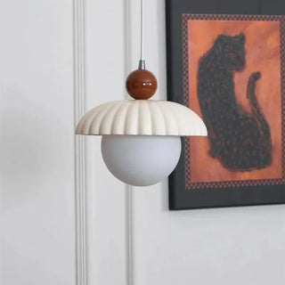 French interior pendant casting warm cozy glow