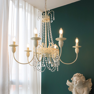 White metal vintage chandelier detail — crystal tassel luxury warm