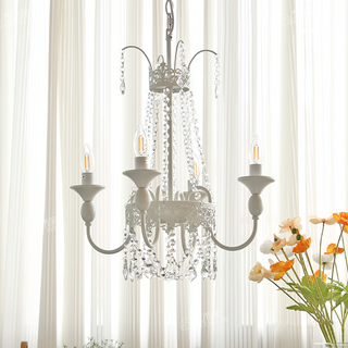 Vintage luxury crystal chandelier detail — white tassel glass warm
