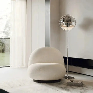 MIROR chrome spherical lamp – in armchair reading corner