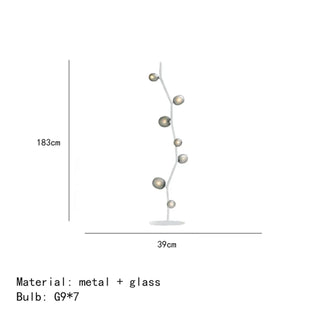 DORITYDE floor lamp – glass globe detail lit