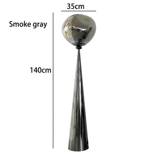 SKILARA amber glass floor lamp – metallic grey room view
