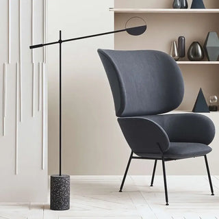 LORER minimalist black floor lamp with long arm – over armchair