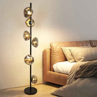 SUPREMETI Gold Metal Glass Globe Floor Lamp - in living room