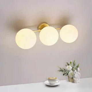 NAIDE Elegant Ceiling Light – Gold and White Ball Design Room Setting