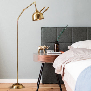 Modern gold rabbit lamp illuminated — iron warm ambient