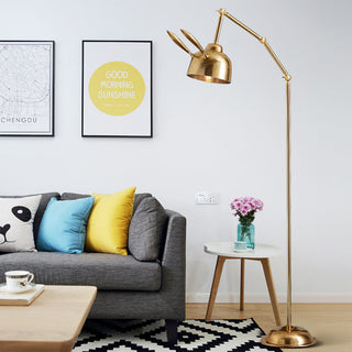 Whimsical gold rabbit lamp detail — iron warm texture