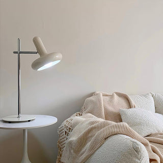 White glass disc lamp close-up — iron base soft detail