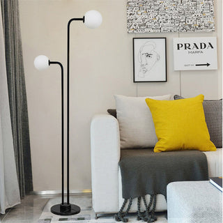 Modern marble floor lamp illuminated — two glass warm glow