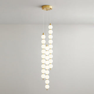White sphere LED chandelier copper fitting overhead close-up