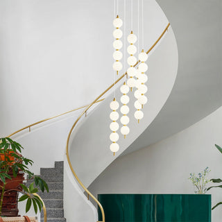 Sleek LED white ball pendant light with copper fitting kitchen