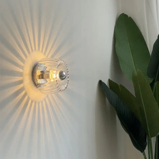 SUN gold glass sunburst wall light warm diffused glow