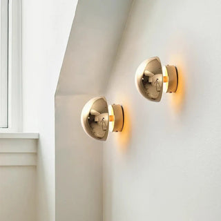 Small round gold wall sconce – warm glow elegant metal finish