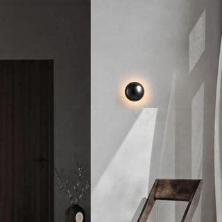 Small round wall sconce in black finish – compact indoor light