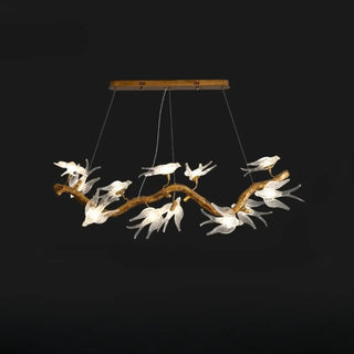 Gold branch pendant close-up — bird motif decorative hanging lamp