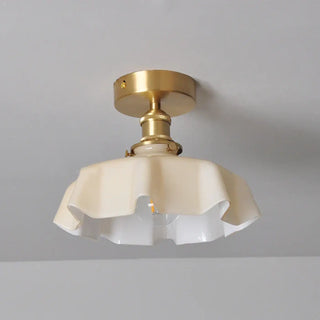Retro pendant light with brass and wavy glass close-up, vintage hanging ceiling lamp