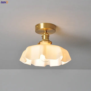 Brass wavy glass pendant lamp, retro ceiling fixture with warm ambient lighting