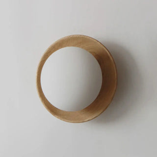 Round wood wall light close-up G9 3000K warm