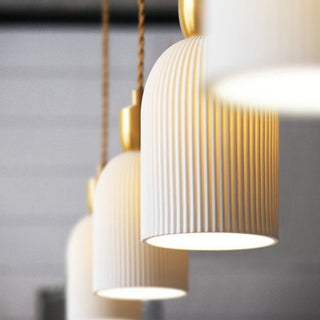 Mid-century cocoon pendant with warm brass hardware