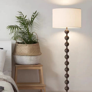 Barbell wood lamp close-up — medieval fabric shade detail