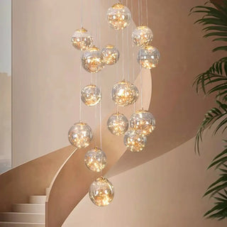 Waterfall crystal pendant close-up — gold ball luxury ceiling fixture