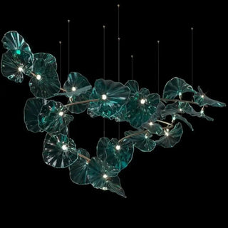 Sculpted glass pendant in interior — organic plant motif hanging light