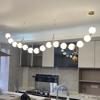 Gold globe pendant light, designer modern ceiling fixture, soft ambient decor