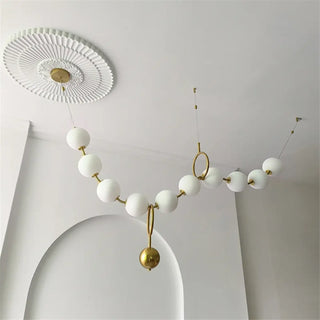 Gold sphere pendant lamp, modern globe design, soft ambient hanging fixture