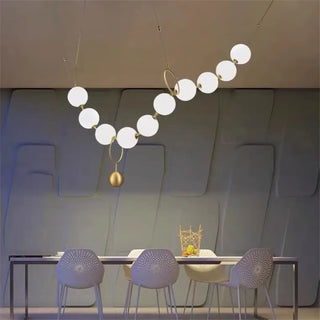 Modern gold globe pendant light, soft ambient ceiling fixture for dining room