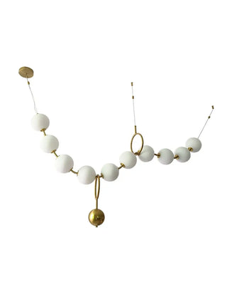 Modern gold pendant, globe style ceiling fixture, warm ambient dining room lamp