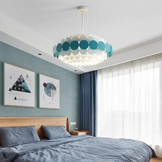 Metal disc pendant light in room, modern elegant designer hanging ceiling lamp