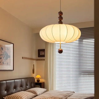 Beige fabric pendant light with wooden ball accents, warm glow for dining room
