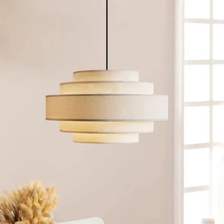 Tiered white fabric pendant lamp close-up, designer hanging ceiling light
