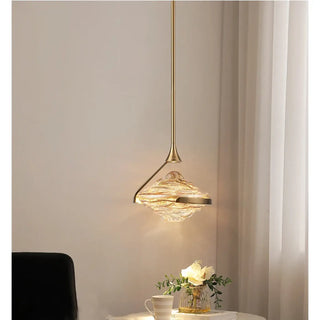 Designer brass pendant in living room — textured glass hanging lamp